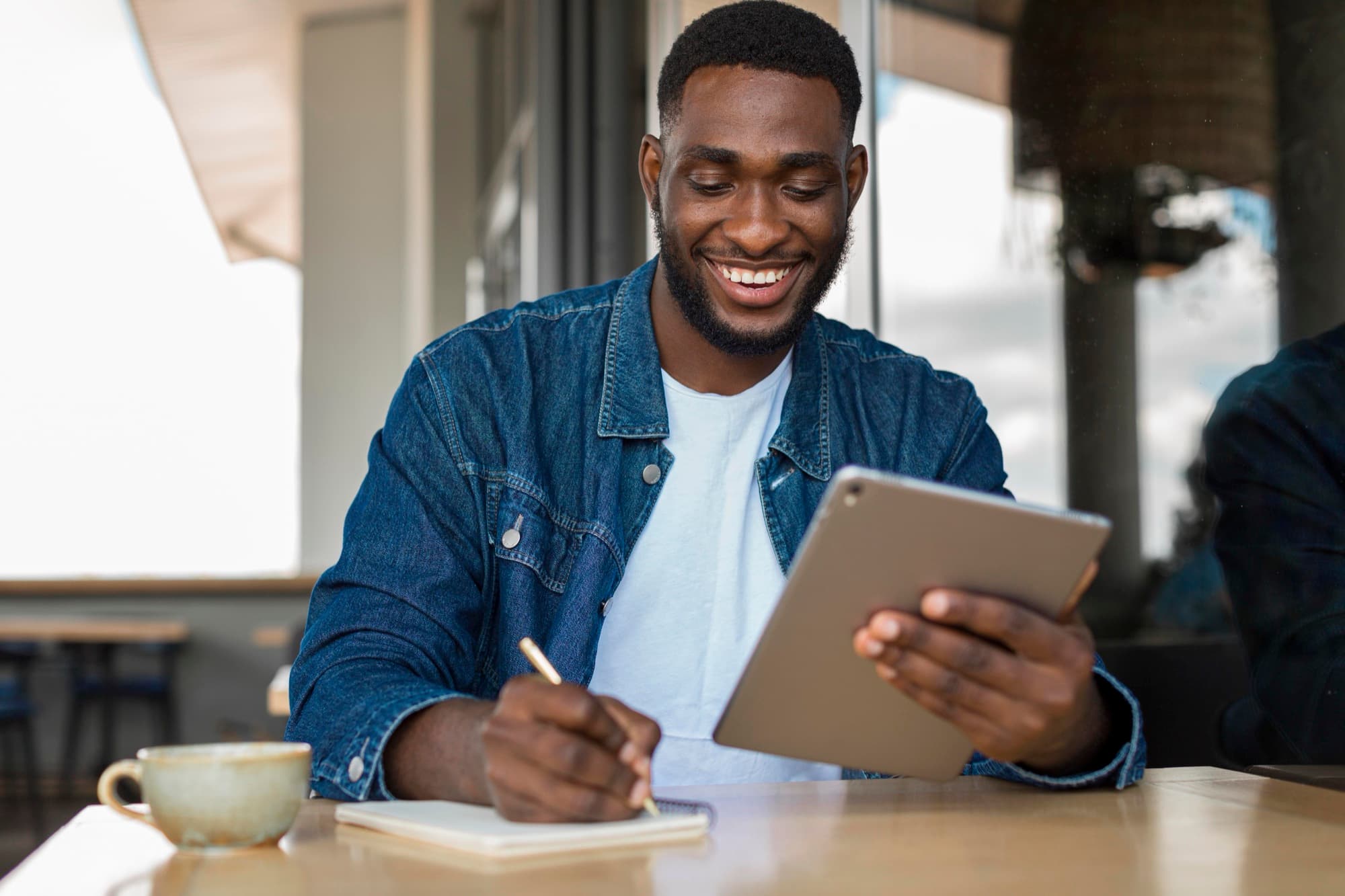 A school proprietor reviewing reports on a tablet